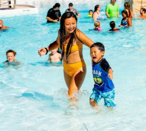 27 Sister brother in pool Six Flags Hurricane Harbor debuts Calypso Springs